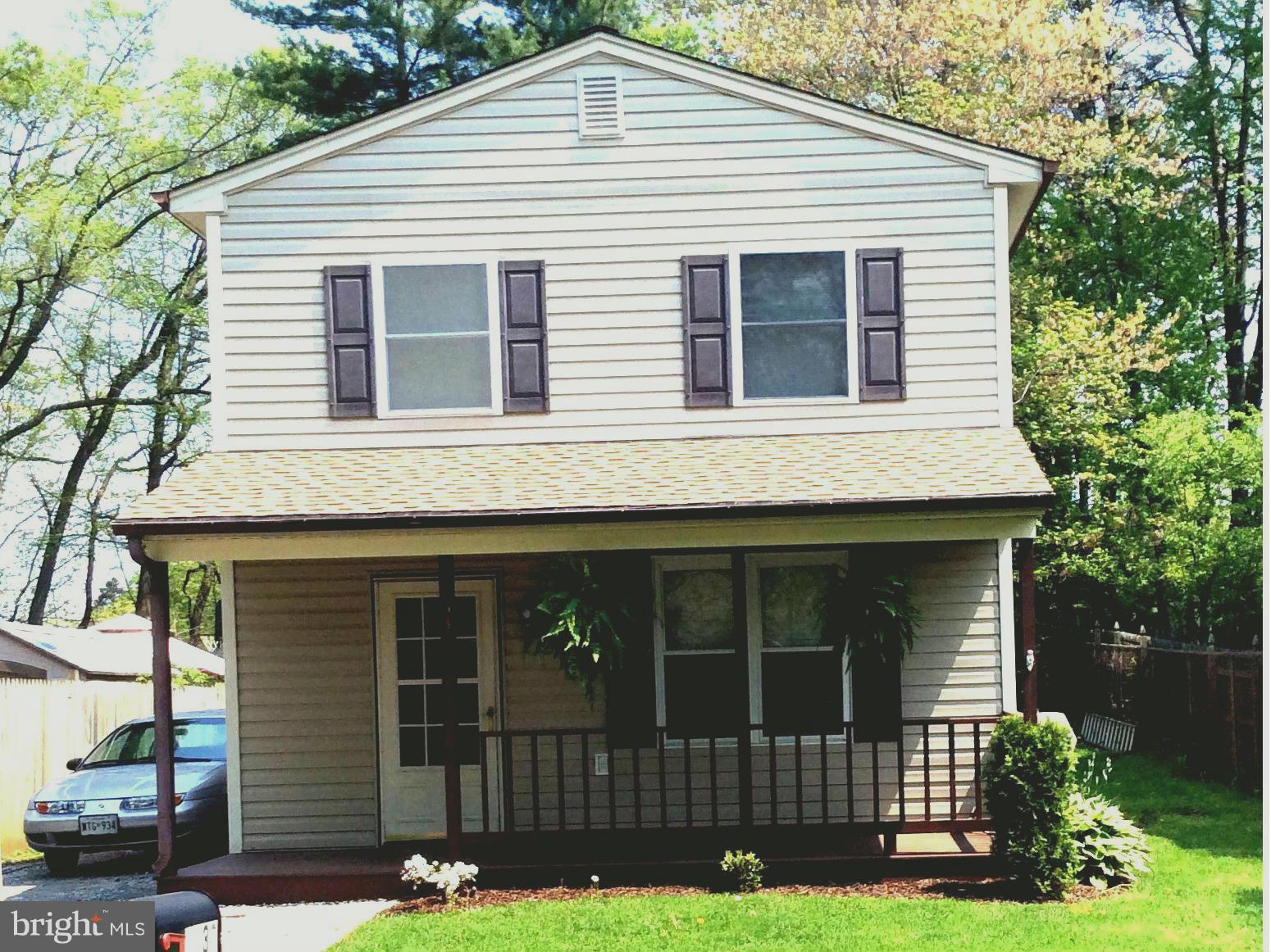 1539 Mayfield Road Edgewater, MD 21037 - Photo 1 of 17 a view of house with a yard and a garden