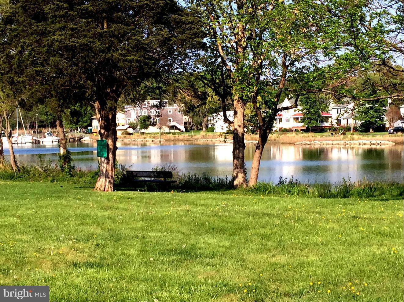 1539 Mayfield Road Edgewater, MD 21037 - Photo 13 of 17 a view of a lake next to a building with large trees