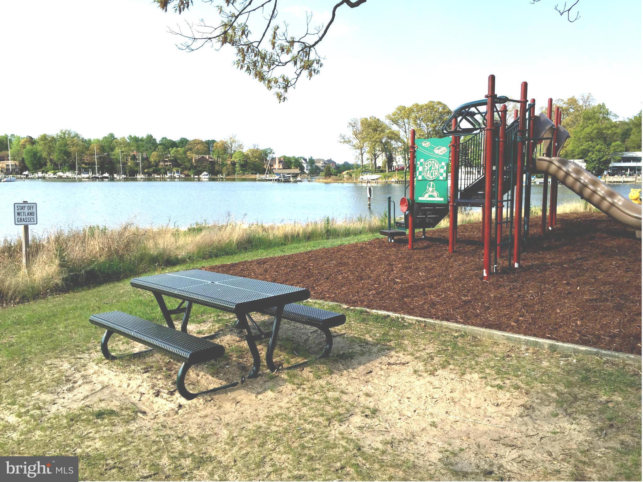 1539 Mayfield Road Edgewater, MD 21037 - Photo 16 of 17 a view of a lake with a bench and lake view