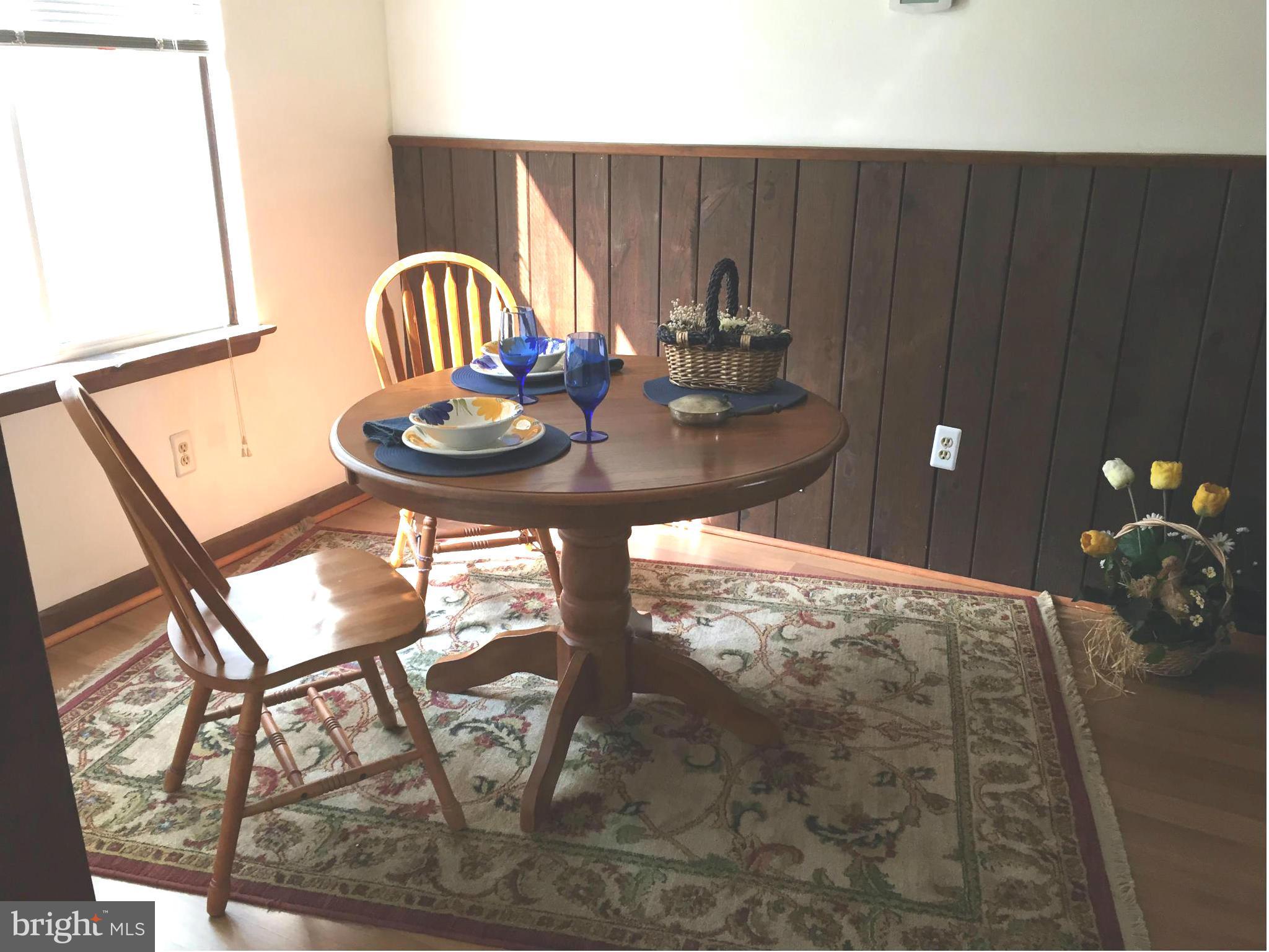 1539 Mayfield Road Edgewater, MD 21037 - Photo 3 of 17 a view of a balcony dining table and chairs