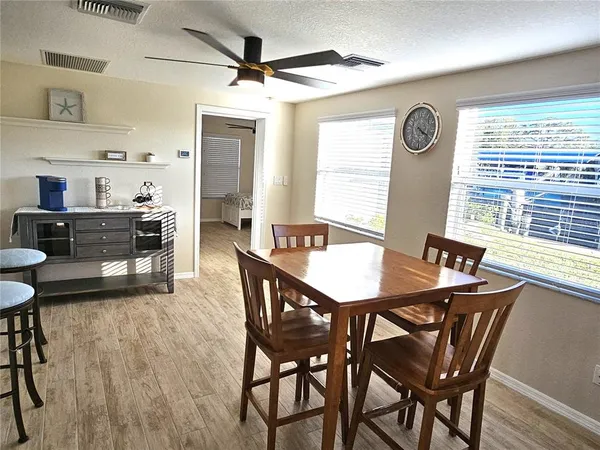 a view of a dining room with furniture and window