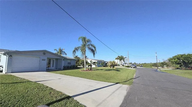 a view of a backyard of the house