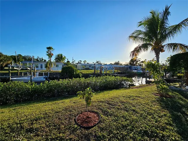 a view of a garden with a building in the background