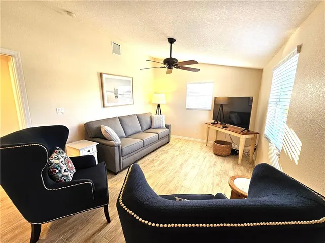 a living room with furniture rug and window