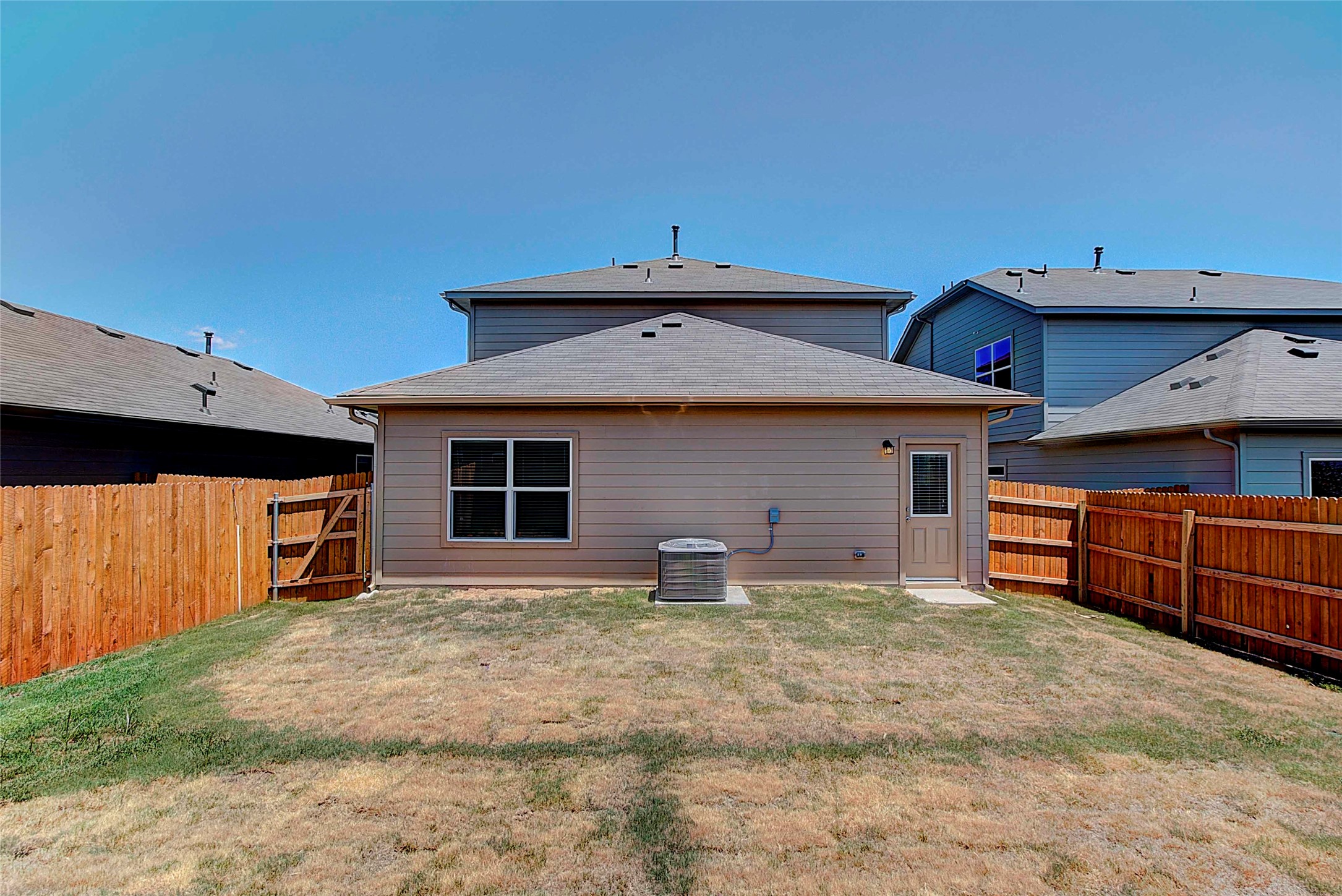 10404 Hatton Lane Austin, TX 78754 - Photo 25 of 27 a front view of a house with a yard
