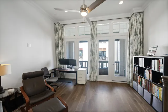 a living room with furniture and a book shelf