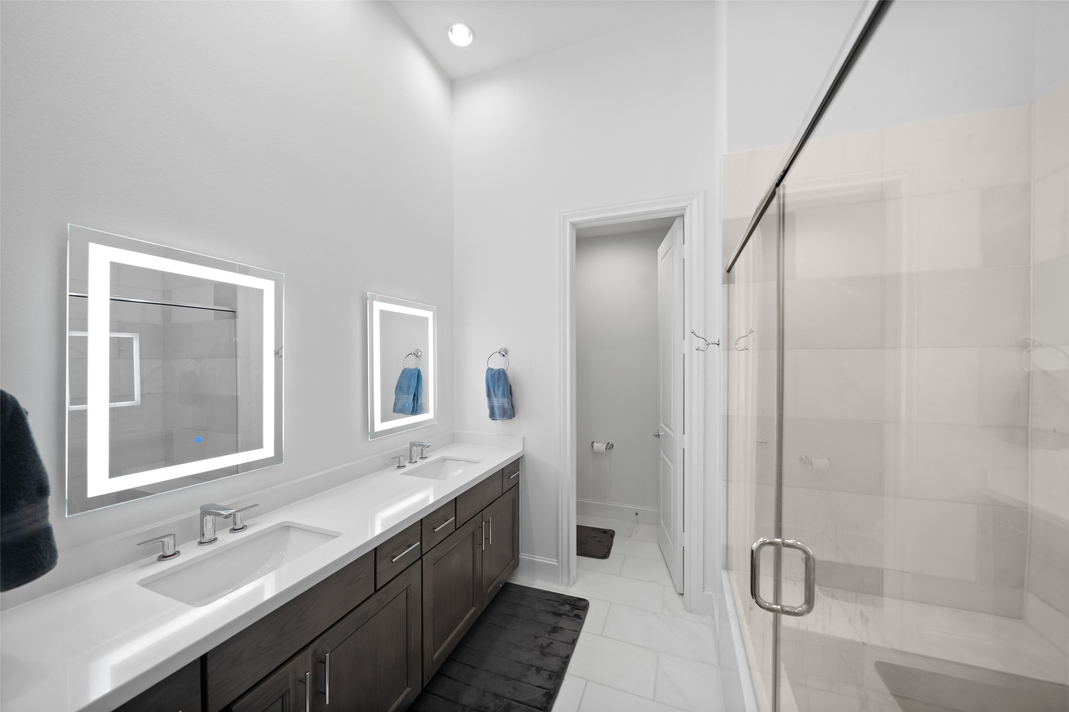 3307 Timbergrove Oaks Street Houston, TX 77008 - Photo 23 of 33 a bathroom with a double vanity sink a toilet and shower
