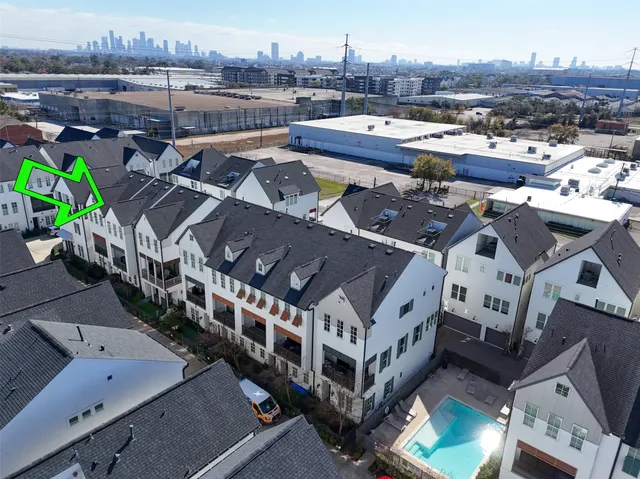 an aerial view of a house with a mountain view