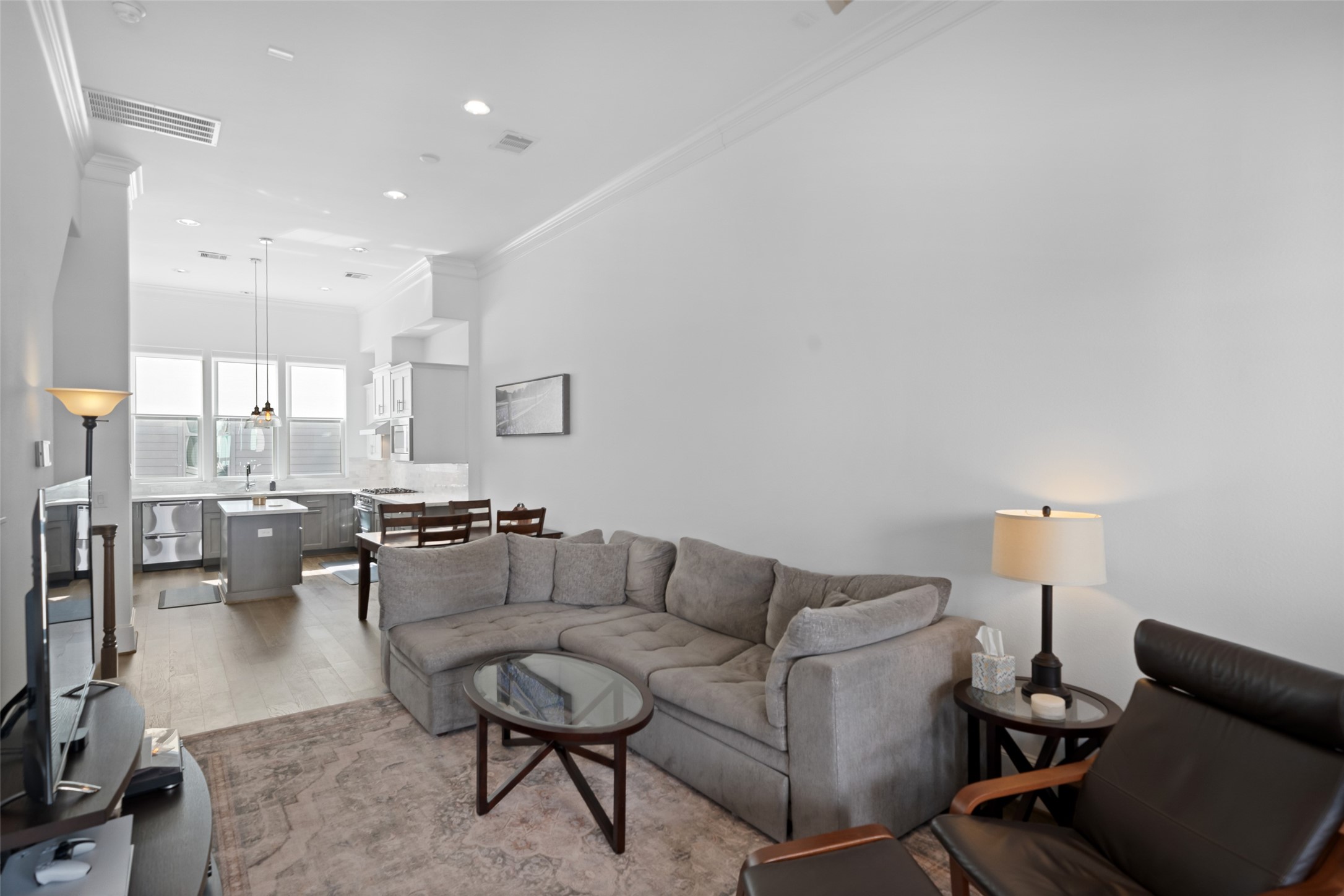 3307 Timbergrove Oaks Street Houston, TX 77008 - Photo 5 of 33 a living room with couches and a dining table with kitchen view