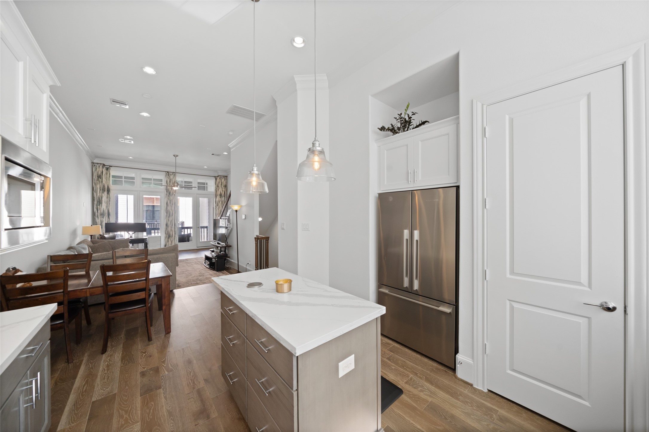 3307 Timbergrove Oaks Street Houston, TX 77008 - Photo 9 of 33 a kitchen with a refrigerator a sink and wooden cabinets