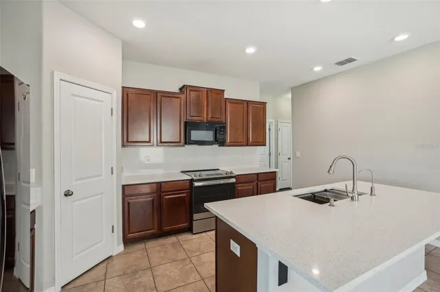 a kitchen with a sink and cabinets