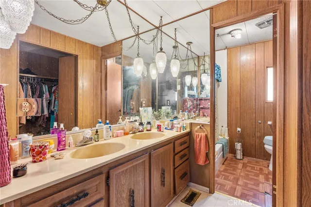 a bathroom with a double vanity sink mirror and double