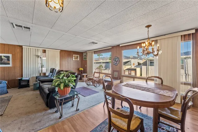a dining room with furniture window and outside view