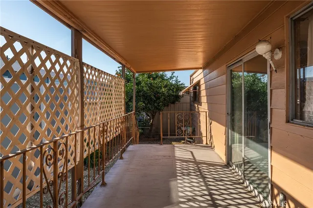 a view of porch with wooden floor and a potted plant
