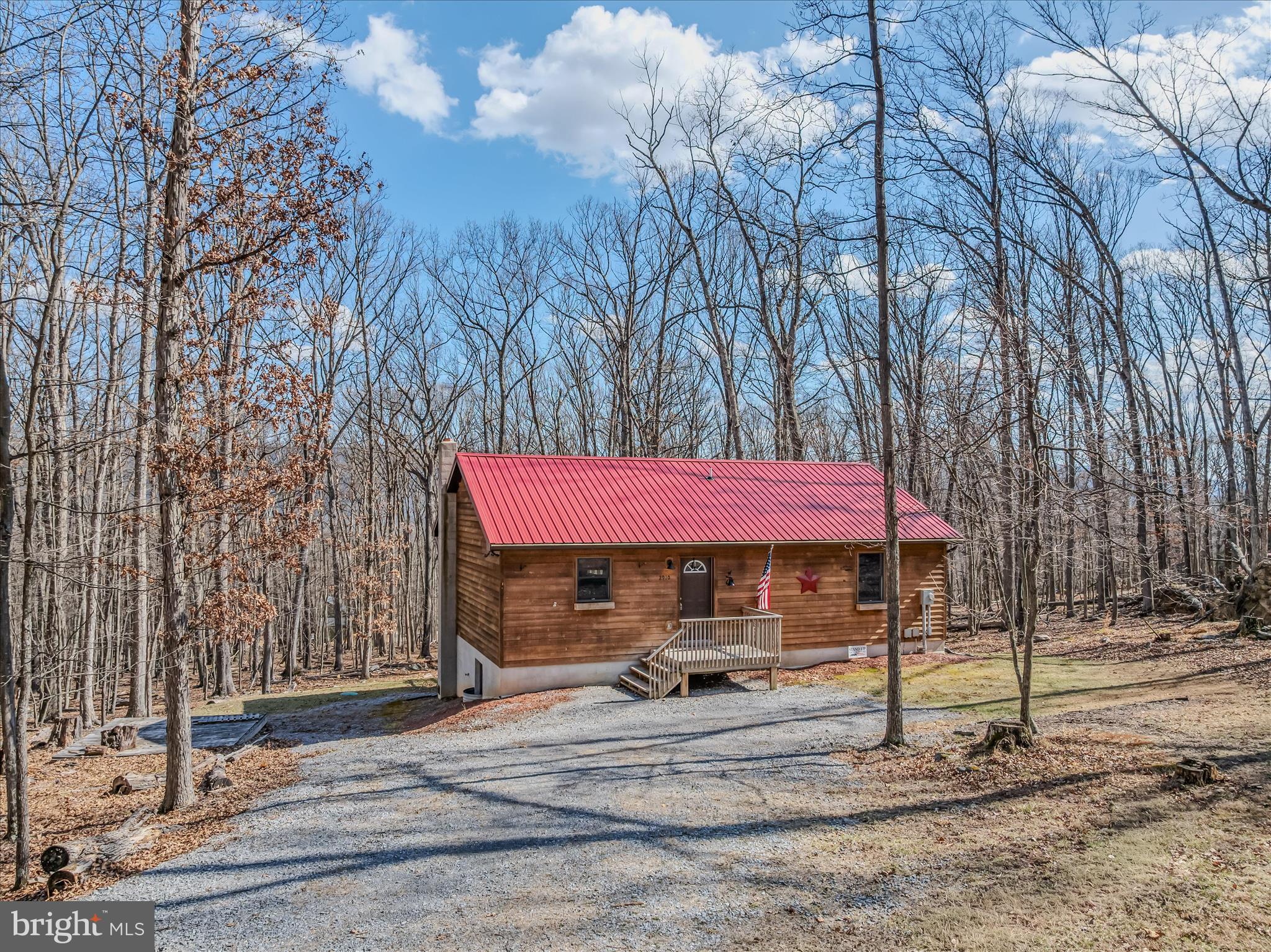 2910 Milo School Road Great Cacapon, WV 25422 - Photo 1 of 55 a view of a house with a patio