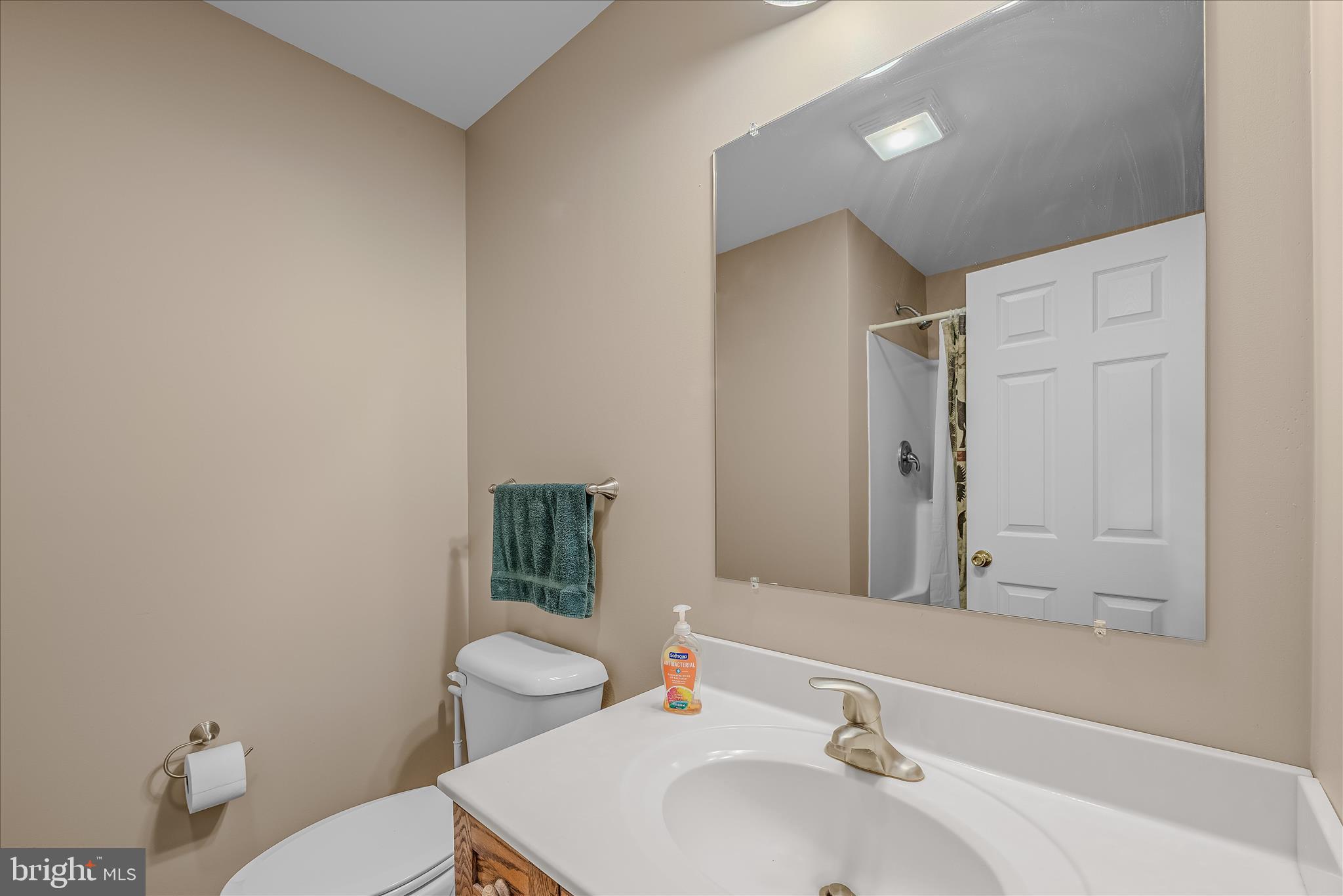2910 Milo School Road Great Cacapon, WV 25422 - Photo 20 of 55 a bathroom with a sink toilet and shower