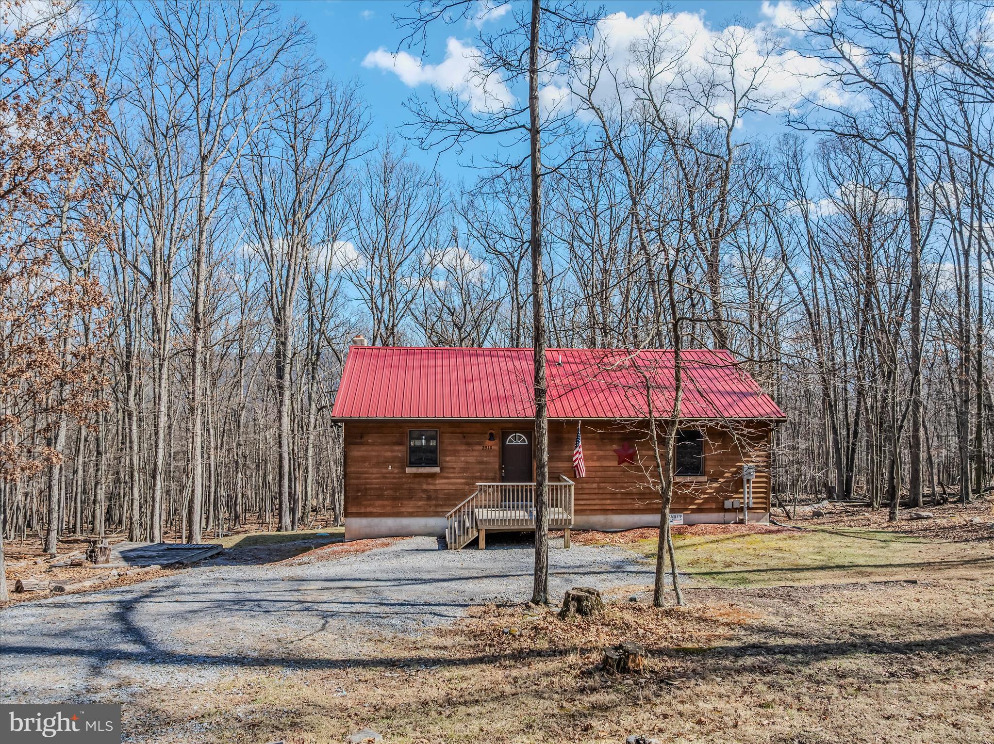 2910 Milo School Road Great Cacapon, WV 25422 - Photo 3 of 55 a front view of house with yard