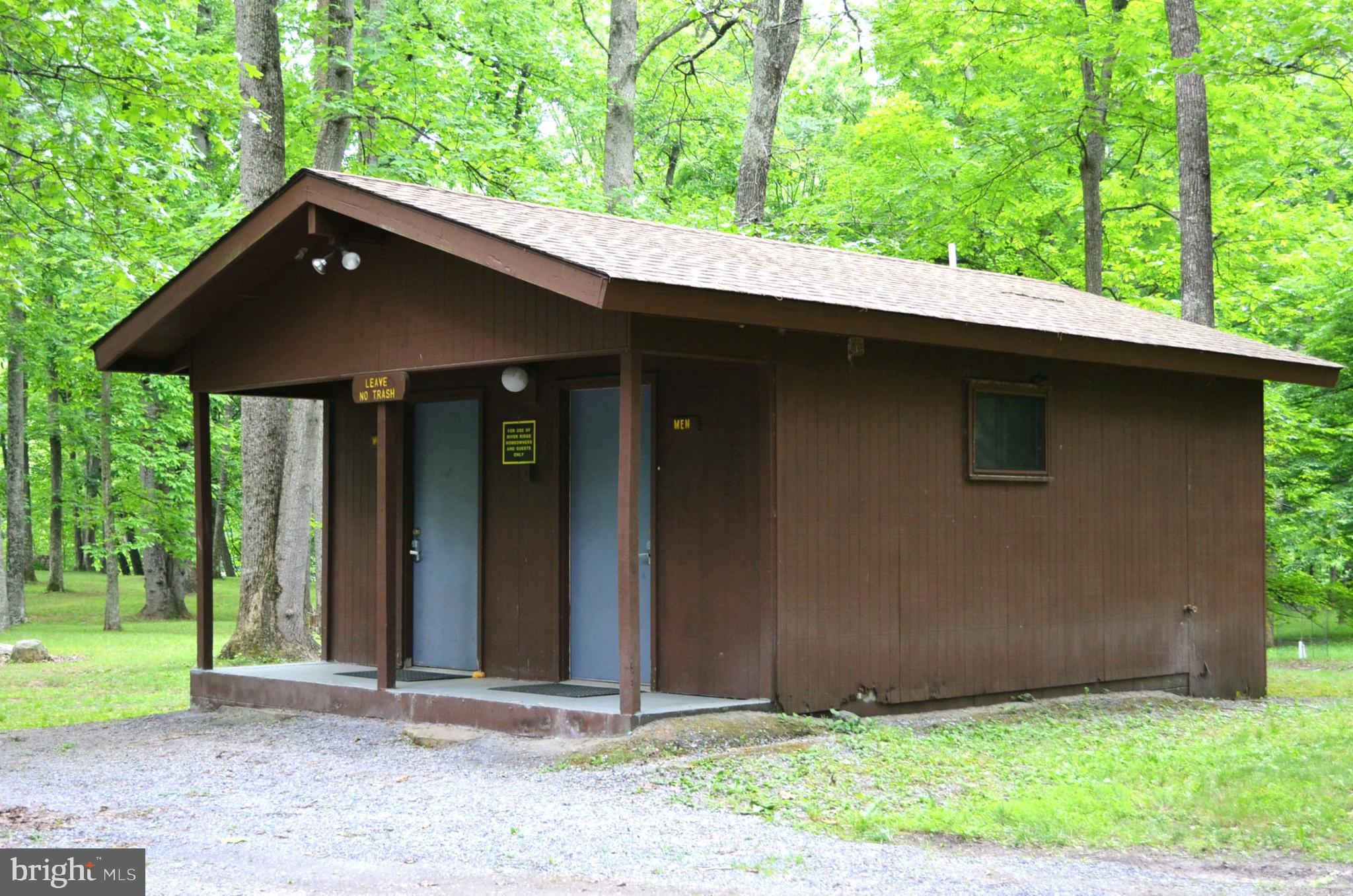 2910 Milo School Road Great Cacapon, WV 25422 - Photo 48 of 55 a front view of a house with garden