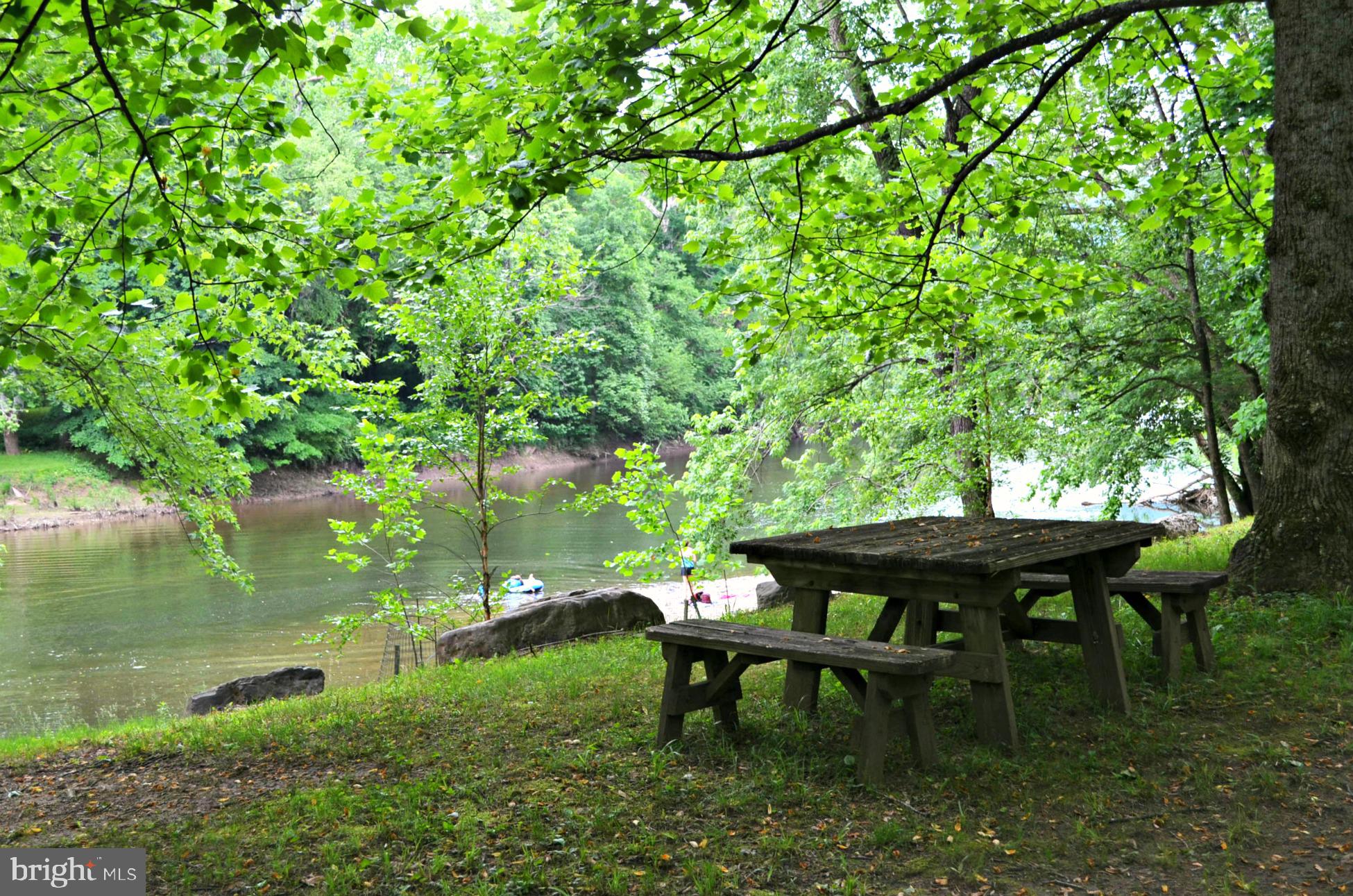 2910 Milo School Road Great Cacapon, WV 25422 - Photo 50 of 55 a view of a table and chairs in the garden in the back