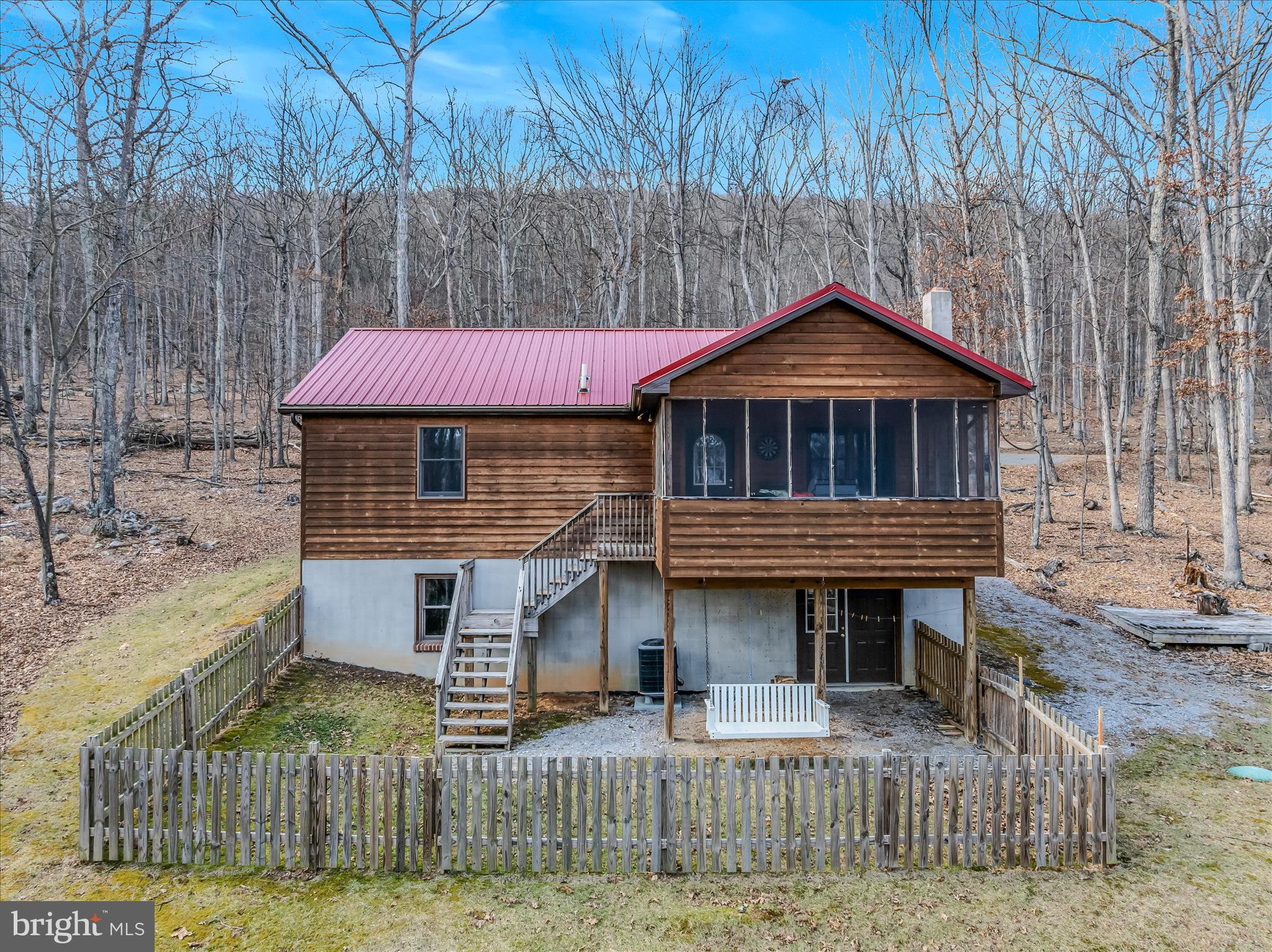 2910 Milo School Road Great Cacapon, WV 25422 - Photo 5 of 55 a front view of a house with garden