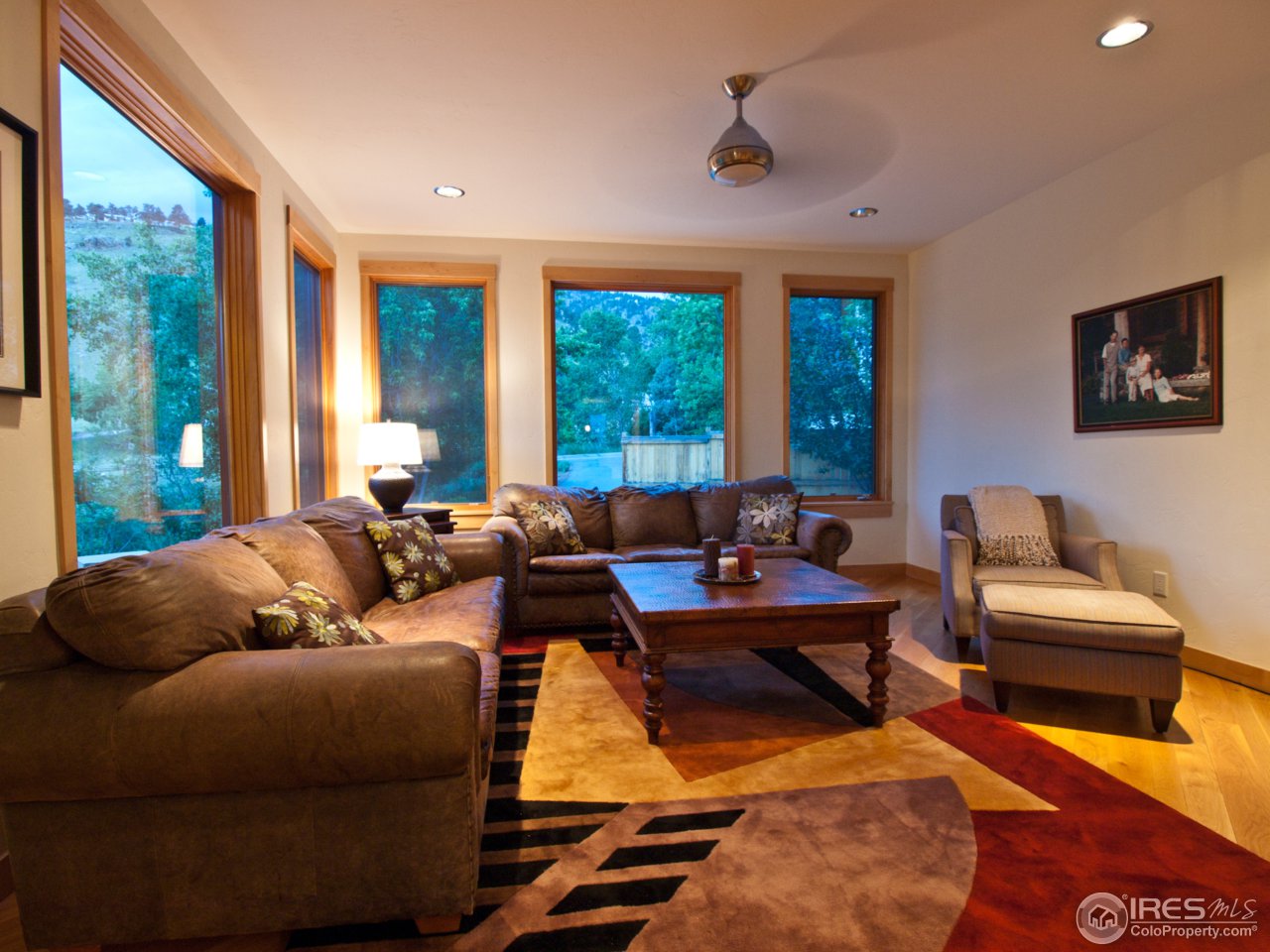 3718 Spring Valley Road Boulder, CO 80304 - Photo 11 of 25 a living room with furniture a rug and a large window