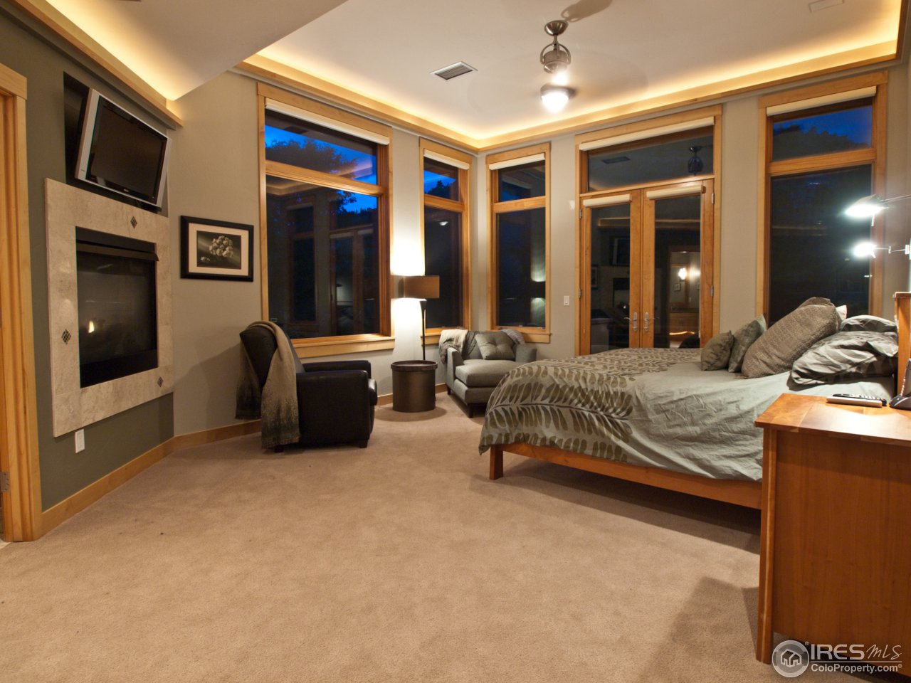 3718 Spring Valley Road Boulder, CO 80304 - Photo 17 of 25 a bedroom with furniture and large windows