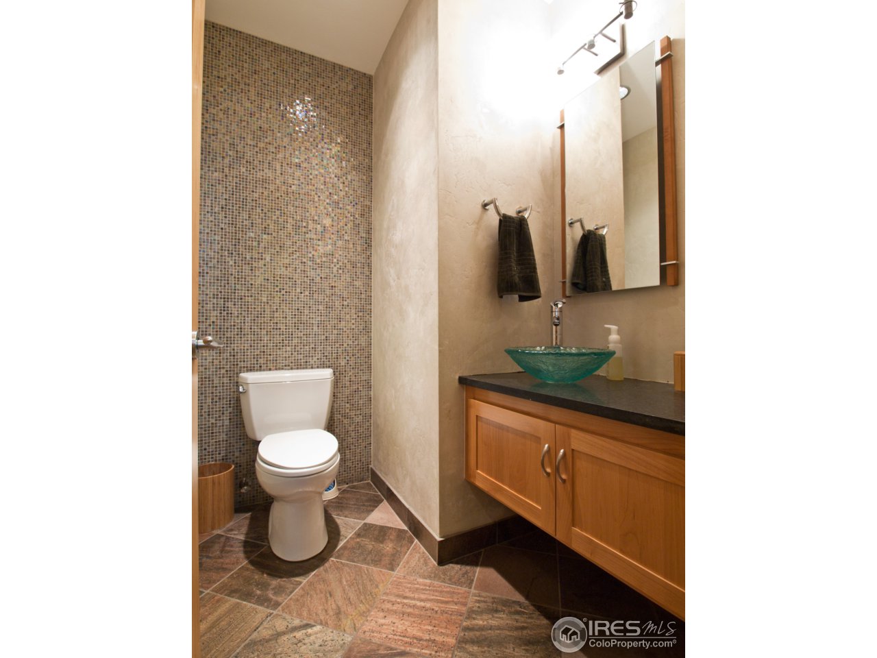 3718 Spring Valley Road Boulder, CO 80304 - Photo 22 of 25 a bathroom with a toilet a sink and mirror