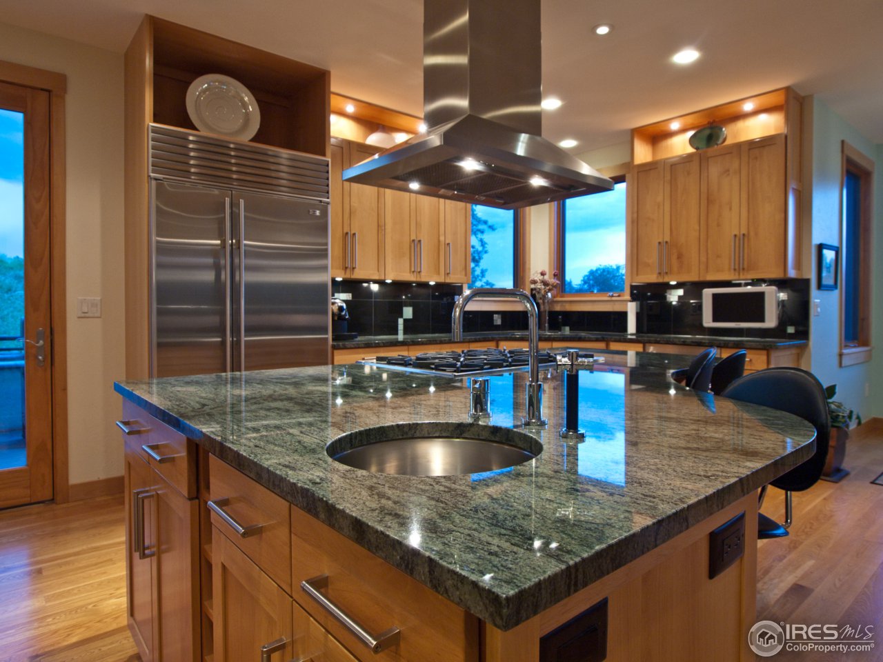 3718 Spring Valley Road Boulder, CO 80304 - Photo 7 of 25 a kitchen with stainless steel appliances granite countertop a sink a counter space and cabinets