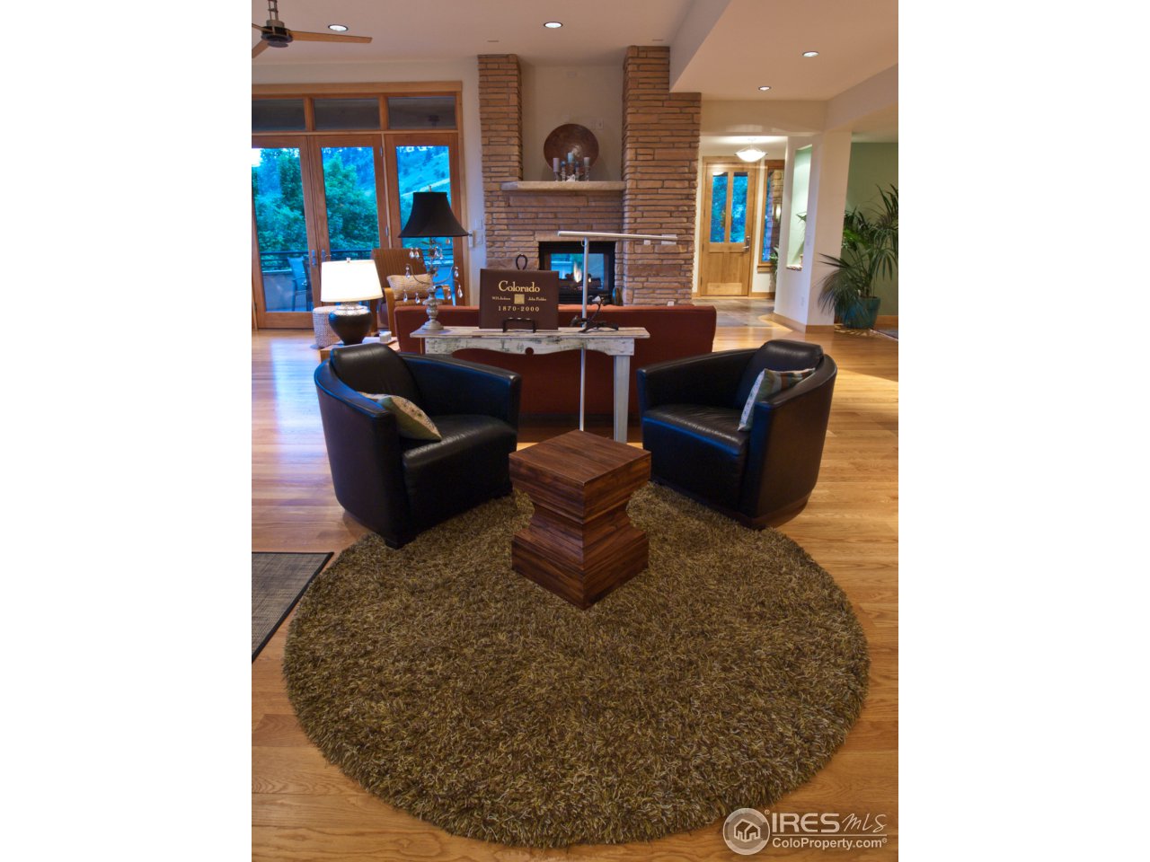 3718 Spring Valley Road Boulder, CO 80304 - Photo 9 of 25 a living room with fireplace furniture and a fireplace