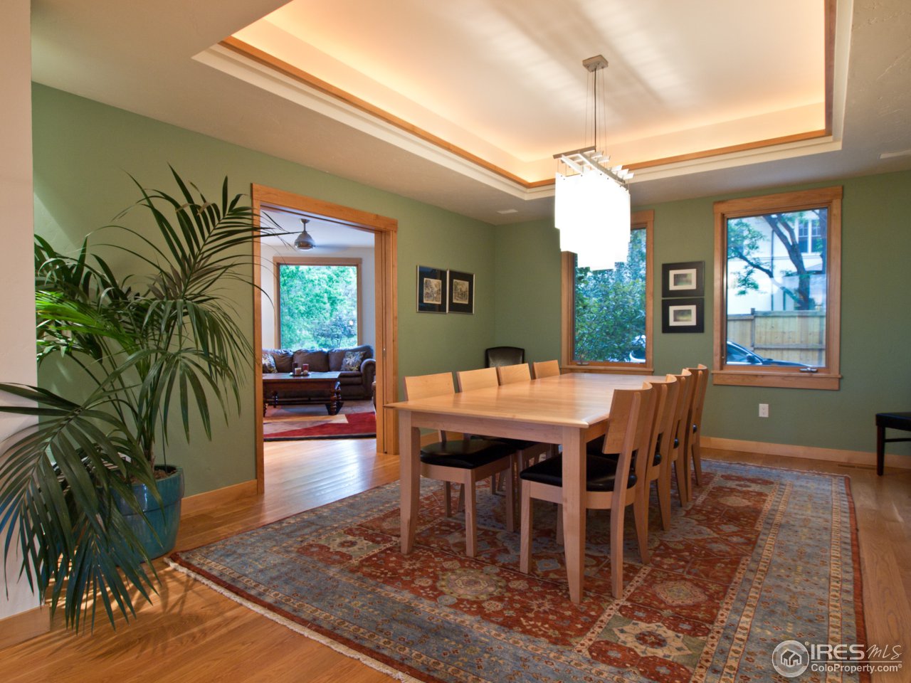 3718 Spring Valley Road Boulder, CO 80304 - Photo 10 of 25 a dining room with furniture window and wooden floor