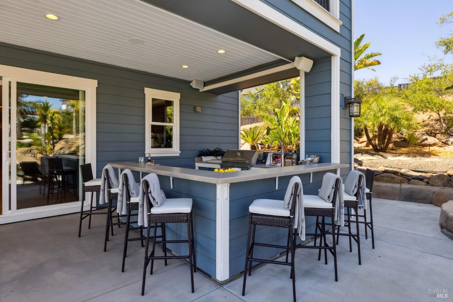 3882 Royal Manor Place Santa Rosa, CA 95404 - Photo 33 of 98 The out-door kitchen is set with a KitchenAid BBQ that has natural gas run to it so you wont need to fill propane tanks, bar seating for 8, outdoor refrigerator, outdoor sink, and plenty of open and shaded seating area.