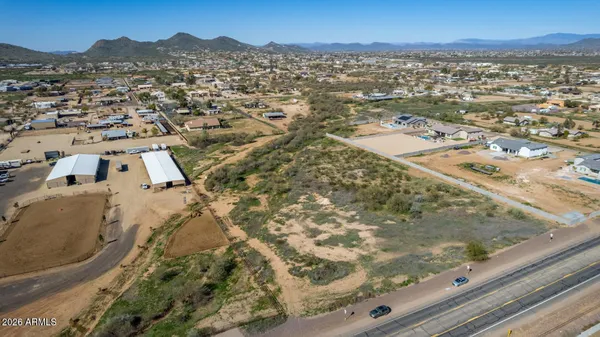an aerial view of residential houses with outdoor space