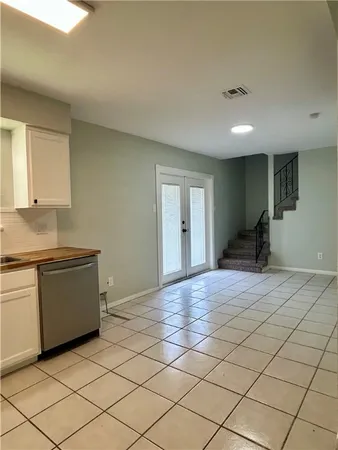 a bedroom with a bed and cabinets
