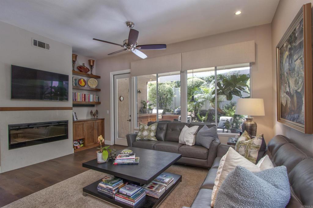 1684 Robin Place Carlsbad, CA 92011 - Photo 12 of 24 a living room with furniture fireplace and flat screen tv