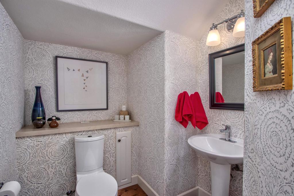 1684 Robin Place Carlsbad, CA 92011 - Photo 14 of 24 a bathroom with a sink vanity mirror and toilet