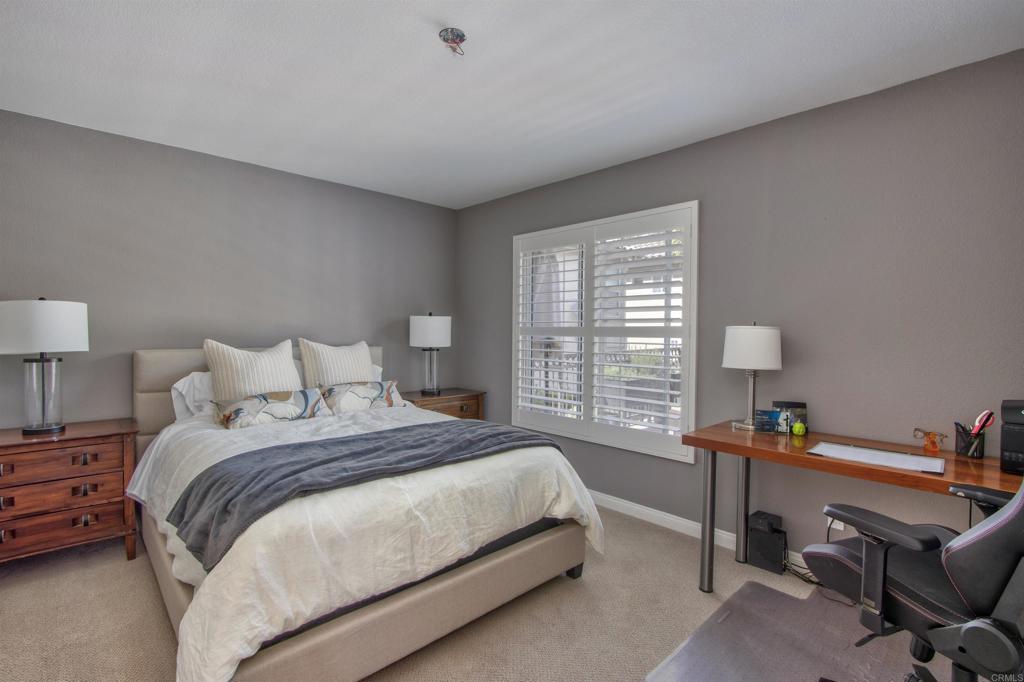 1684 Robin Place Carlsbad, CA 92011 - Photo 19 of 24 a bedroom with a bed and a window