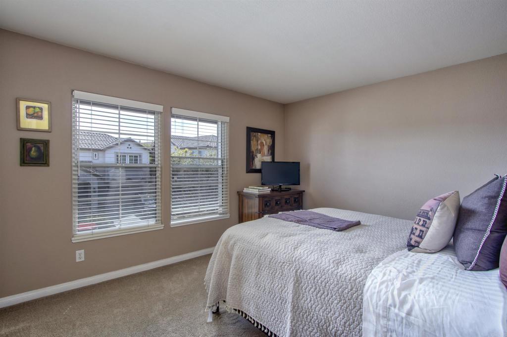 1684 Robin Place Carlsbad, CA 92011 - Photo 20 of 24 a bedroom with a bed and large windows