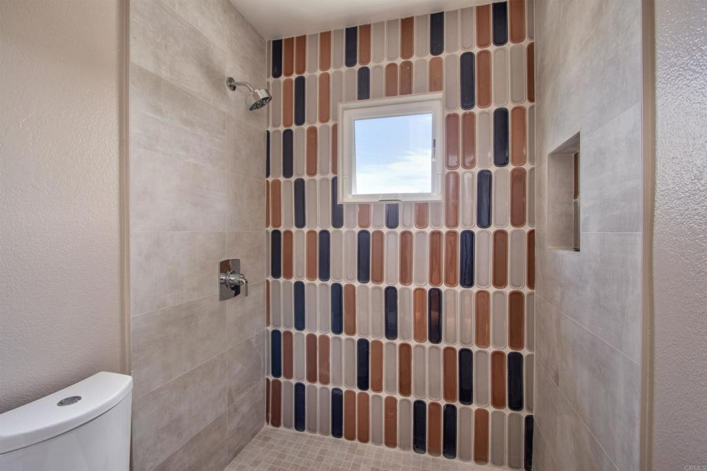 1684 Robin Place Carlsbad, CA 92011 - Photo 21 of 24 a view of a bathroom with tub and sink