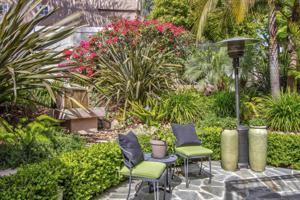 1684 Robin Place Carlsbad, CA 92011 - Photo 3 of 24 a view of a chairs and table in a backyard