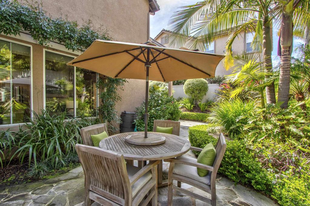 1684 Robin Place Carlsbad, CA 92011 - Photo 4 of 24 a view of a table and chairs under an umbrella