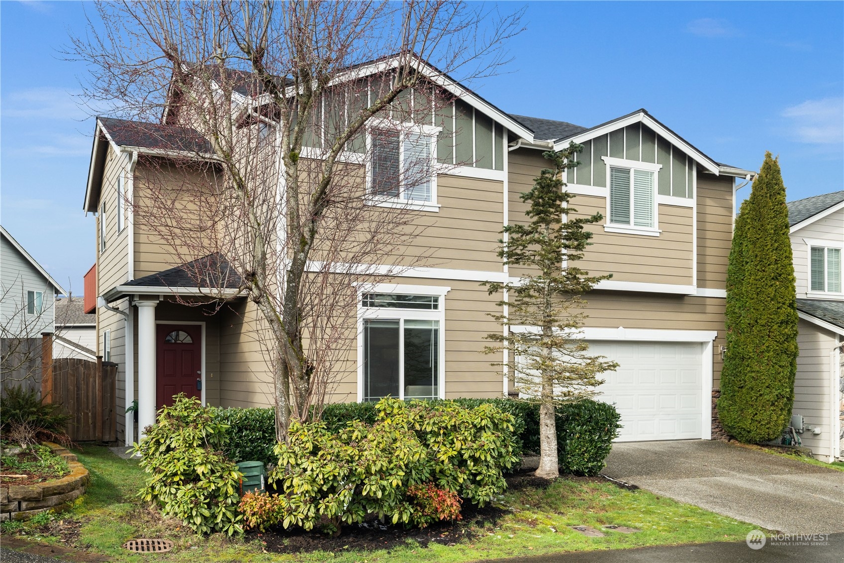1012 186th Street Southeast Bothell, WA 98012 - Photo 1 of 40 a front view of a house with garden