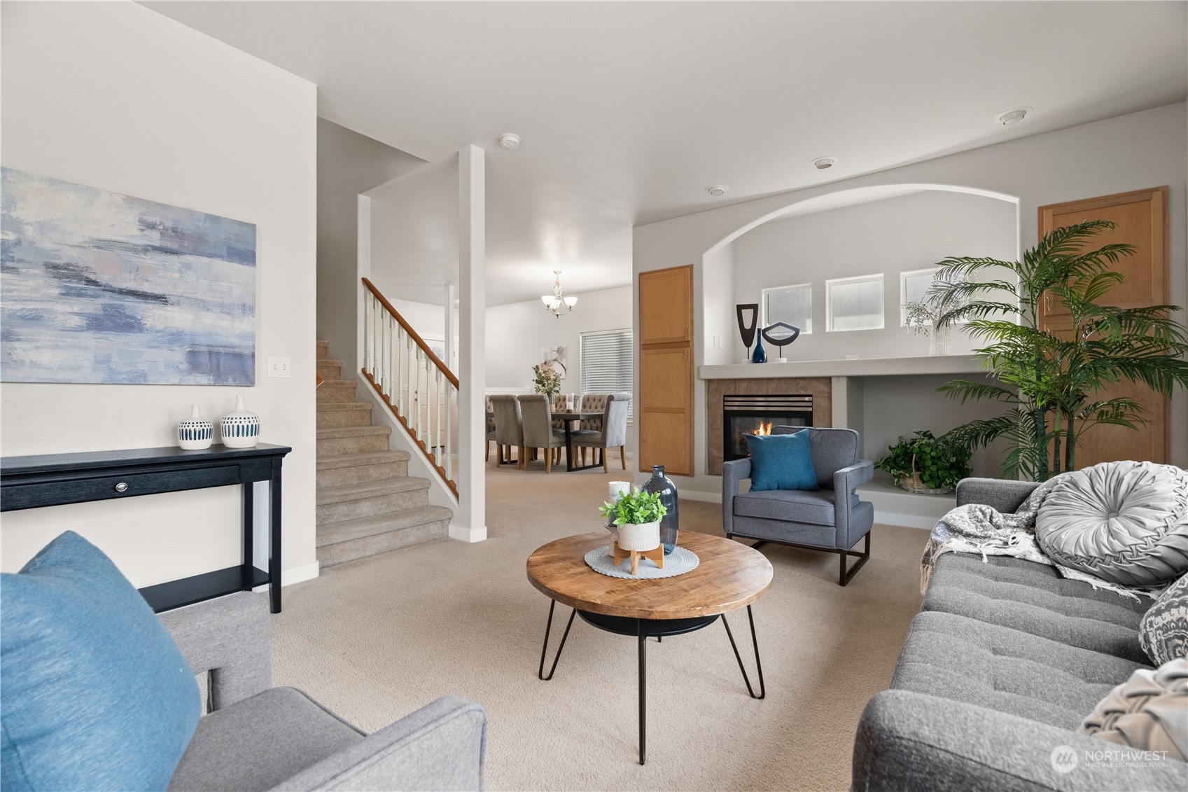 1012 186th Street Southeast Bothell, WA 98012 - Photo 11 of 40 a living room with furniture and a fireplace