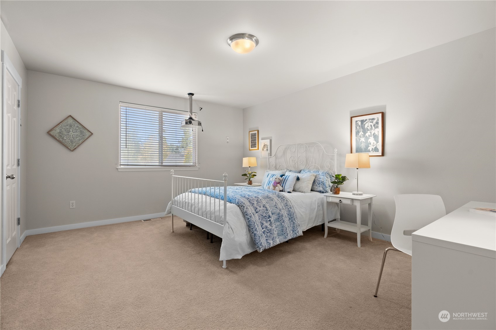 1012 186th Street Southeast Bothell, WA 98012 - Photo 14 of 40 a bedroom with a bed and a window