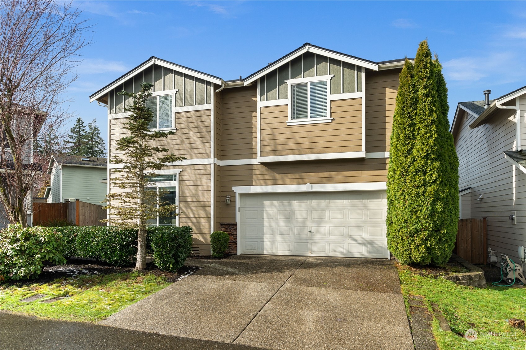 1012 186th Street Southeast Bothell, WA 98012 - Photo 2 of 40 a front view of a house with garden