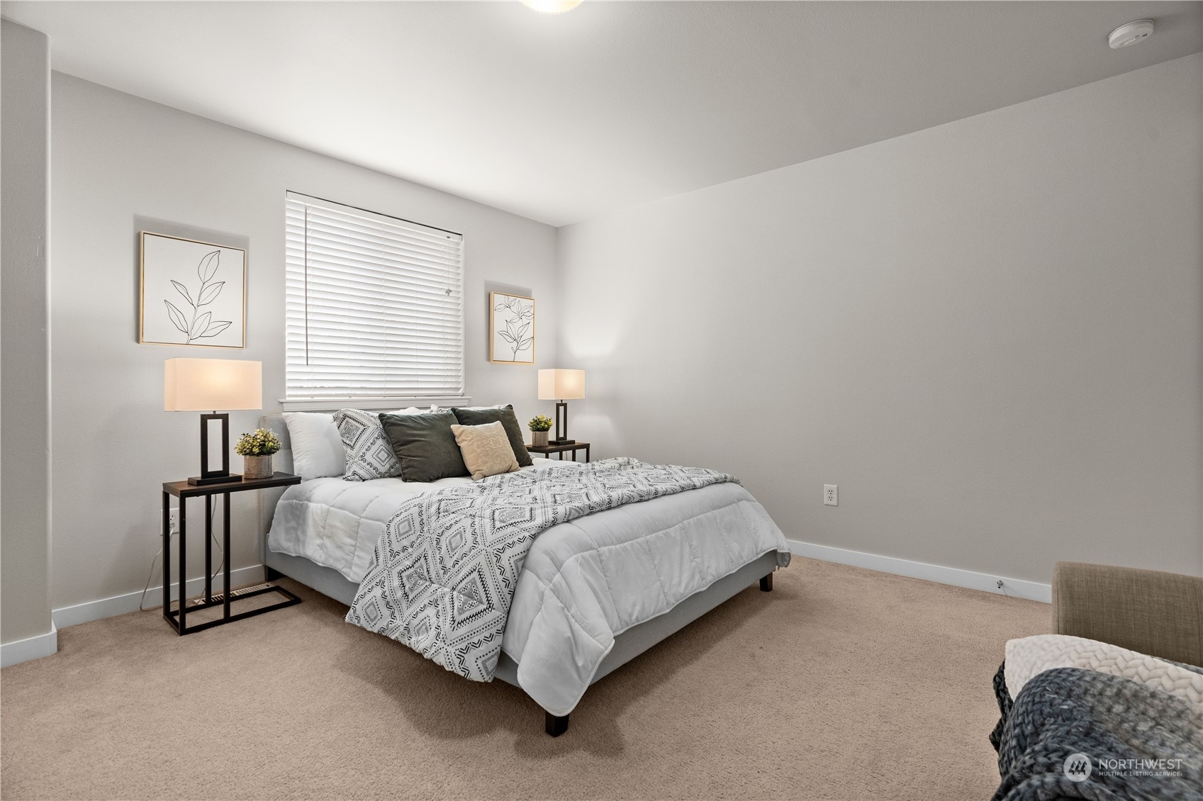 1012 186th Street Southeast Bothell, WA 98012 - Photo 21 of 40 a spacious bedroom with a bed and a couch