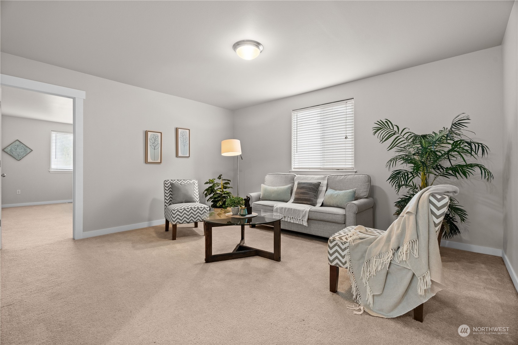 1012 186th Street Southeast Bothell, WA 98012 - Photo 23 of 40 a living room with furniture and a potted plant