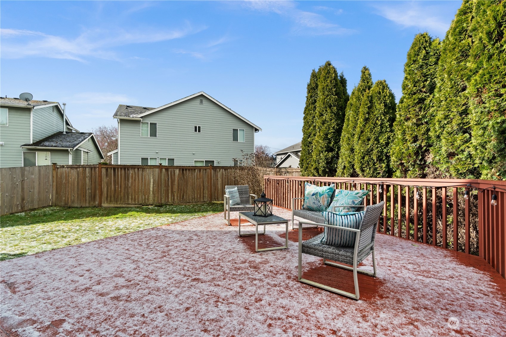 1012 186th Street Southeast Bothell, WA 98012 - Photo 28 of 40 a roof deck with table and chairs and potted plants with wooden fence