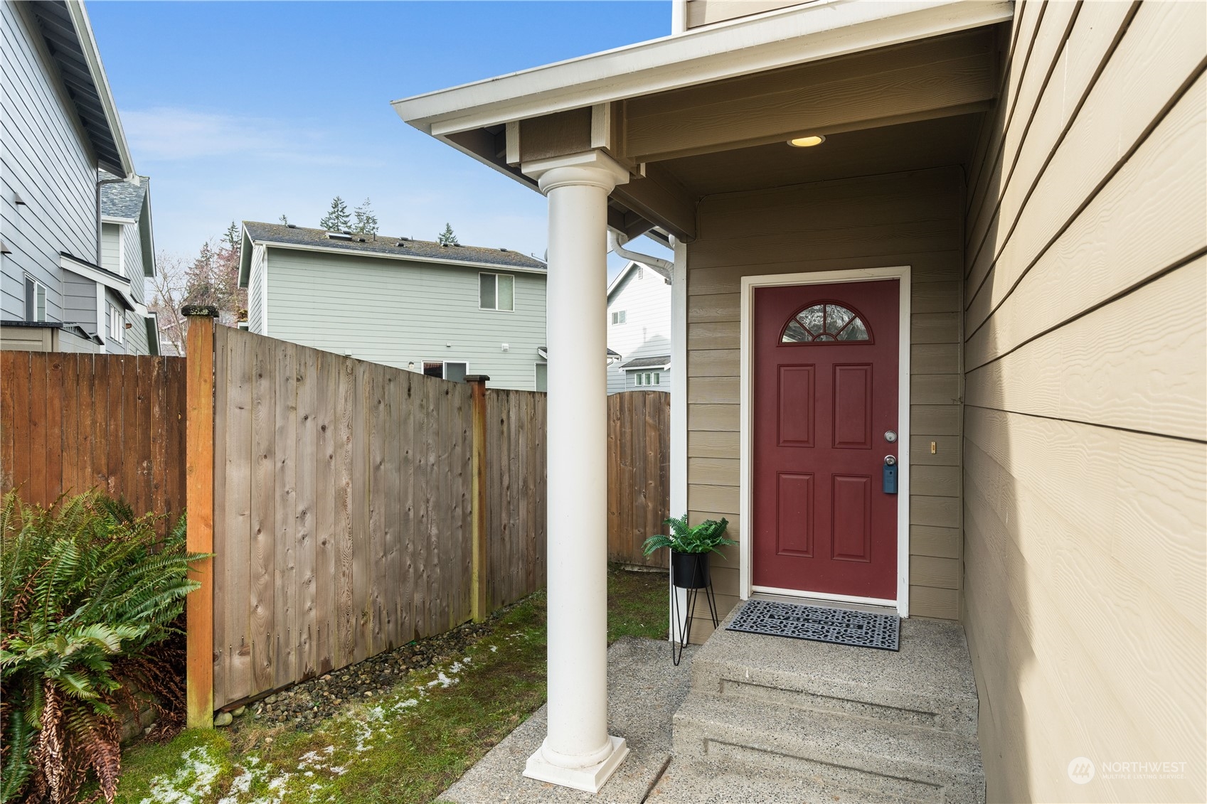 1012 186th Street Southeast Bothell, WA 98012 - Photo 4 of 40 a view of a wooden door of the house