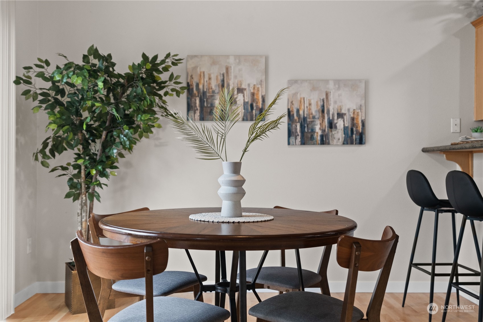 1012 186th Street Southeast Bothell, WA 98012 - Photo 6 of 40 a view of a dining room with furniture and wooden floor