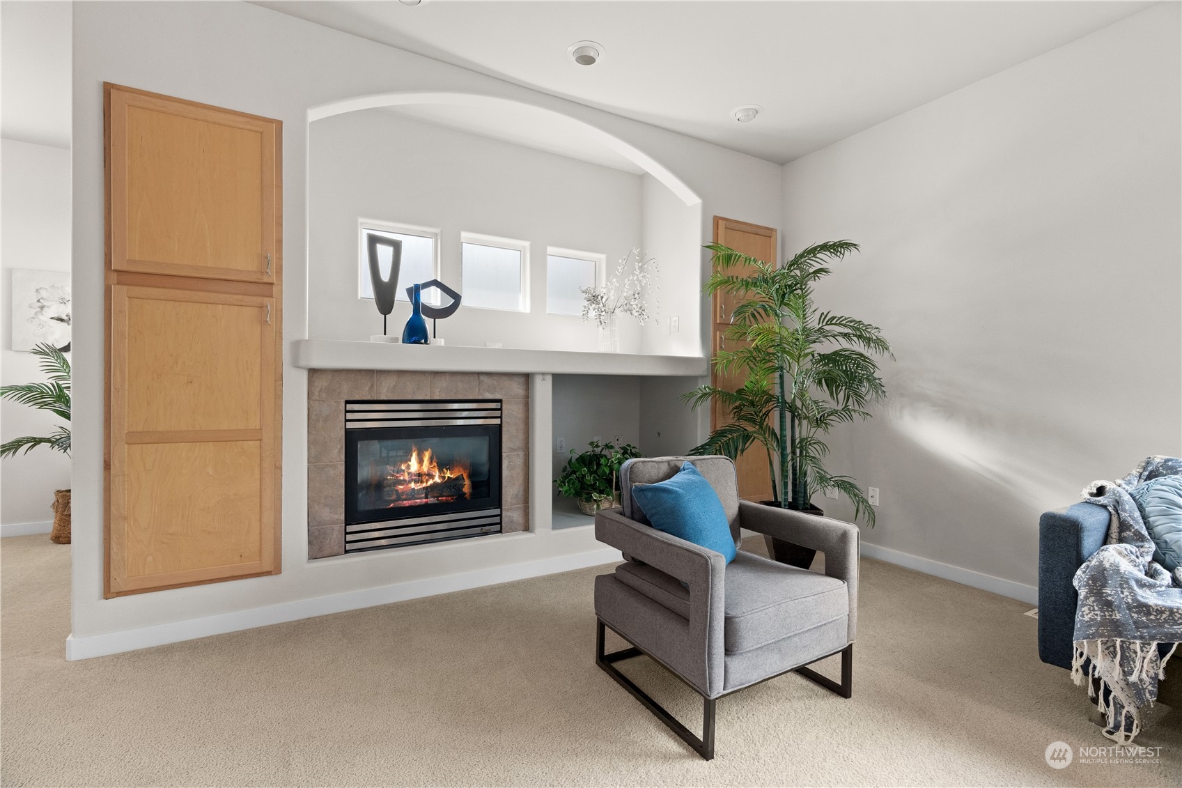1012 186th Street Southeast Bothell, WA 98012 - Photo 9 of 40 a living room with furniture and a fireplace